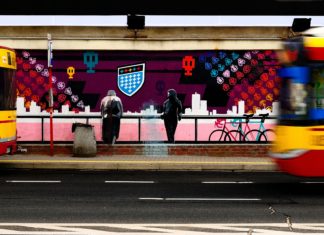 Arriving Early for Your Long Bus Ride Comes with a Long List of Benefits A bus in front of street art
