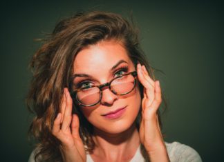 Makeup Tips for Glasses Wearers A portrait of a woman wearing glasses