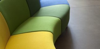 Curved sofa in green, orange and yellow