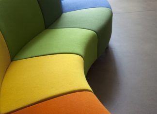 Curvy Furniture Pieces That You Need in Your Home ASAP Curved sofa in green, orange and yellow
