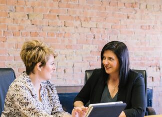 What To Remember When Negotiating Salary Women in a meeting