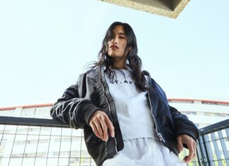 Leather Bomber Jackets Make a Major Comeback as Winter’s Ultimate Cold-Weather Staple Woman wearing a leather bomber jacket