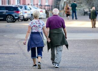 Physical Activity Could Add Up to Eleven Years to Life Expectancy For Americans Over 40 Older couple taking exercise together outdoors