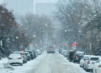 Essential Car Maintenance Tips for Preparing Your Vehicle for Winter A snowy street lined with vehicles in Montreal, Canada