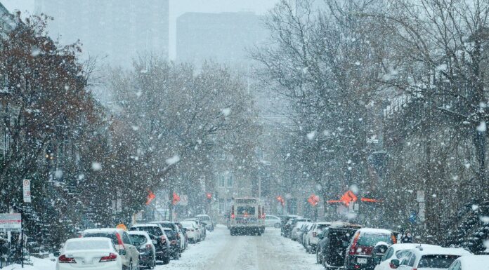 Essential Car Maintenance Tips for Preparing Your Vehicle for Winter A snowy street lined with vehicles in Montreal, Canada