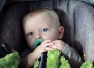 Evenflo Unveils SensorySoothe™: A Game-Changing Car Seat Feature Designed to Calm Fussy Babies Baby in car seat