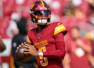 Commanders Upset Lions 45-31 to Advance to NFC Championship Commanders quarterback Jayden Daniels