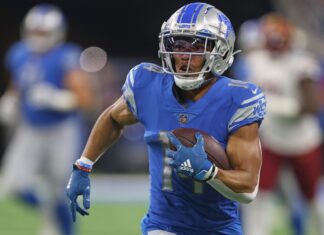 Lions Roar Past Vikings to Clinch NFC North Title and No. 1 Seed Detroit Lions wide receiver Amon-Ra St. Brown in September 2022